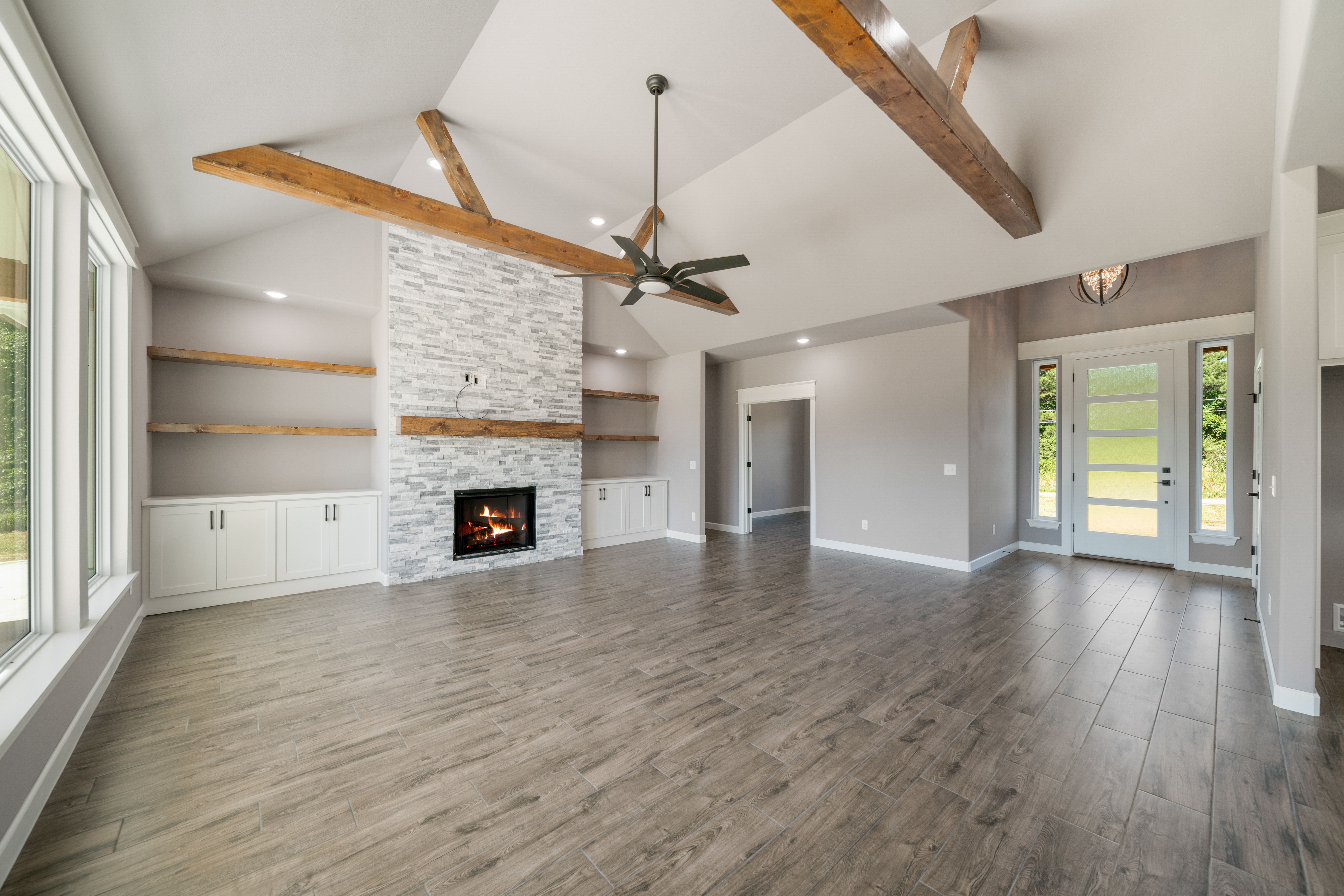 Stylish living room with modern design and custom features by Mahogany Homes.