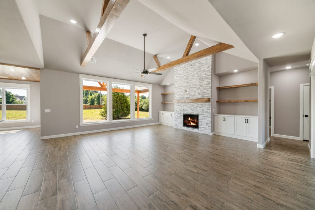 Sophisticated living room with top-tier finishes and open layout by Mahogany Homes.