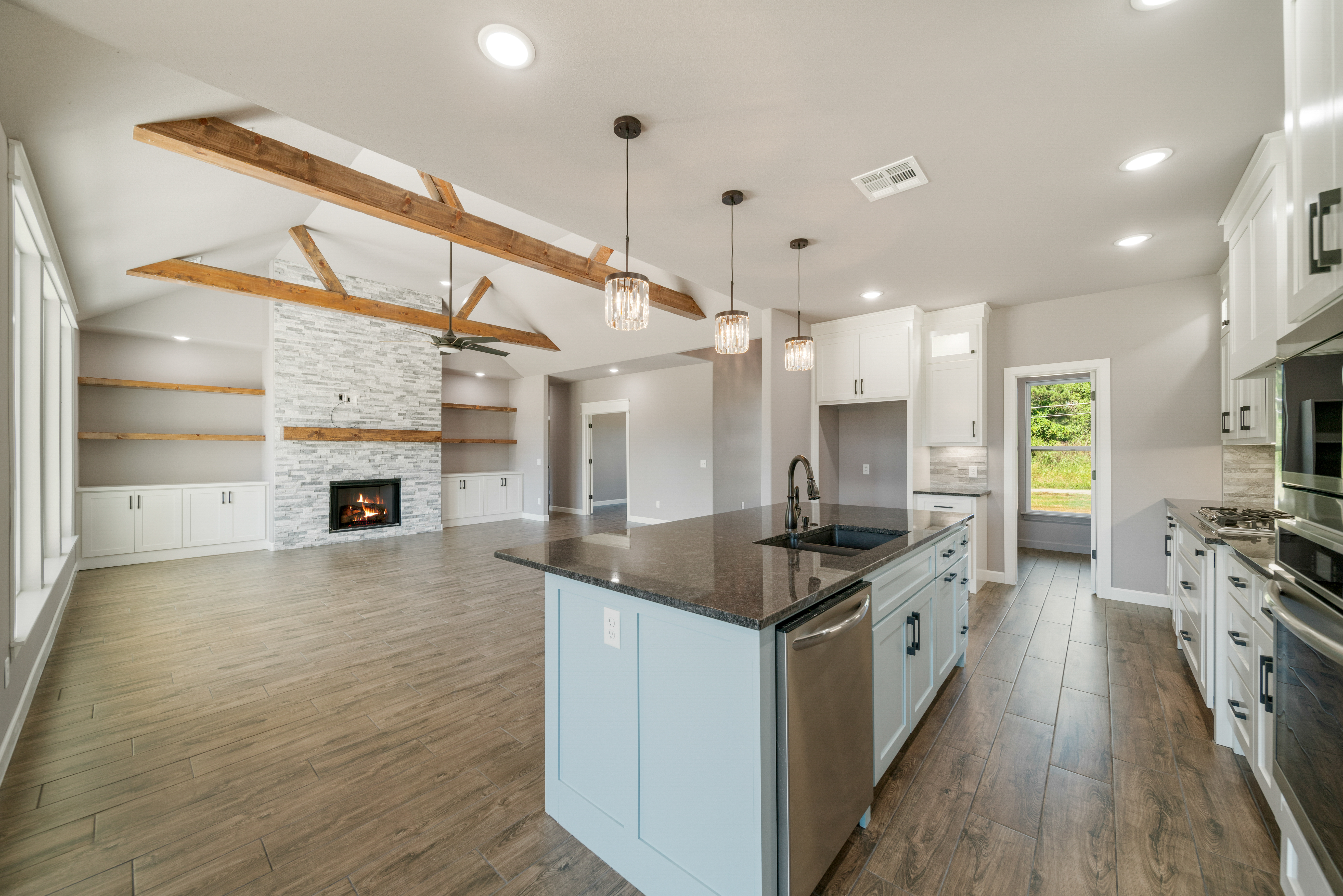 Contemporary living room with sleek furniture and custom design by Mahogany Homes Tulsa.