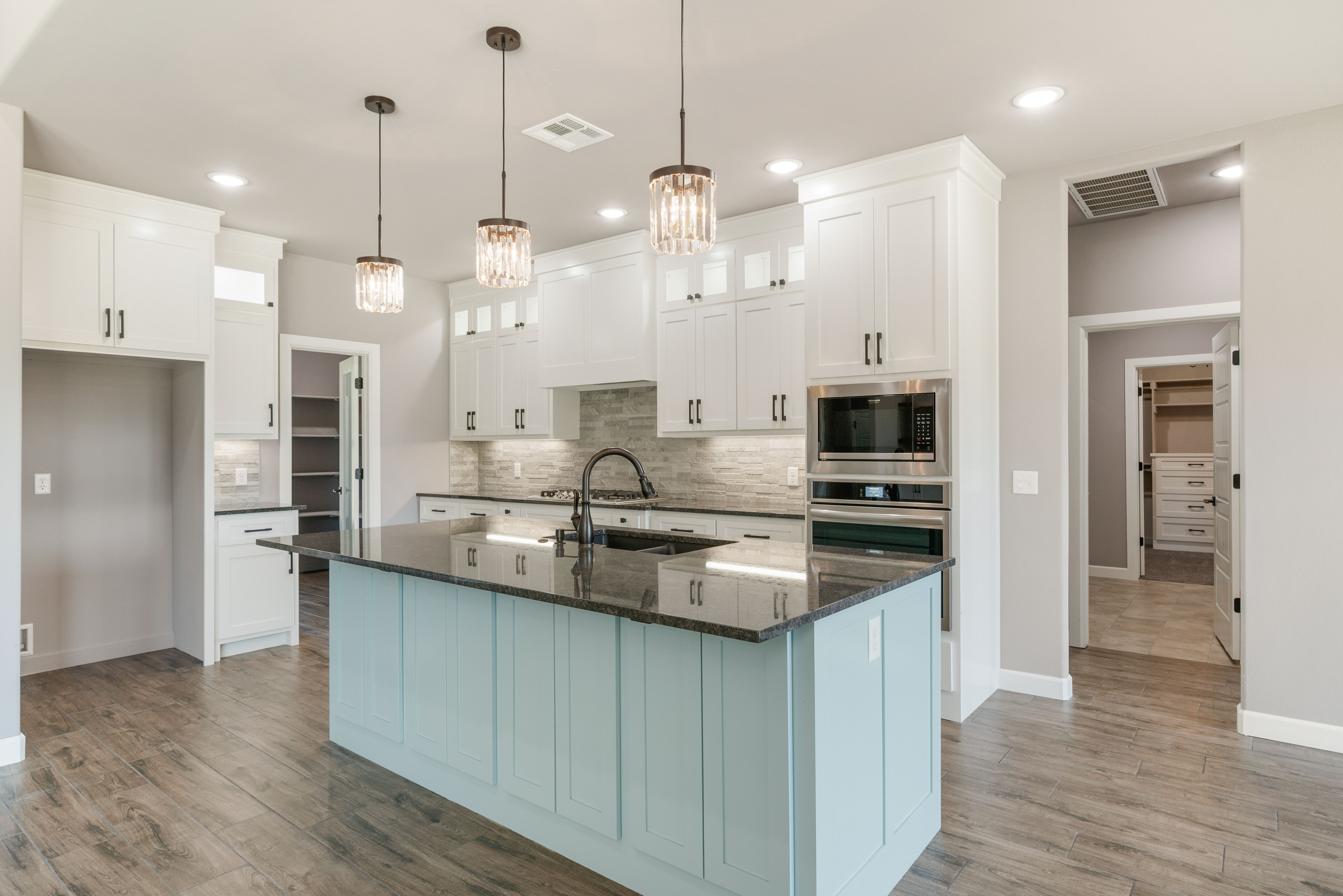 Stylish and functional kitchen design with custom details by Mahogany Homes Tulsa.