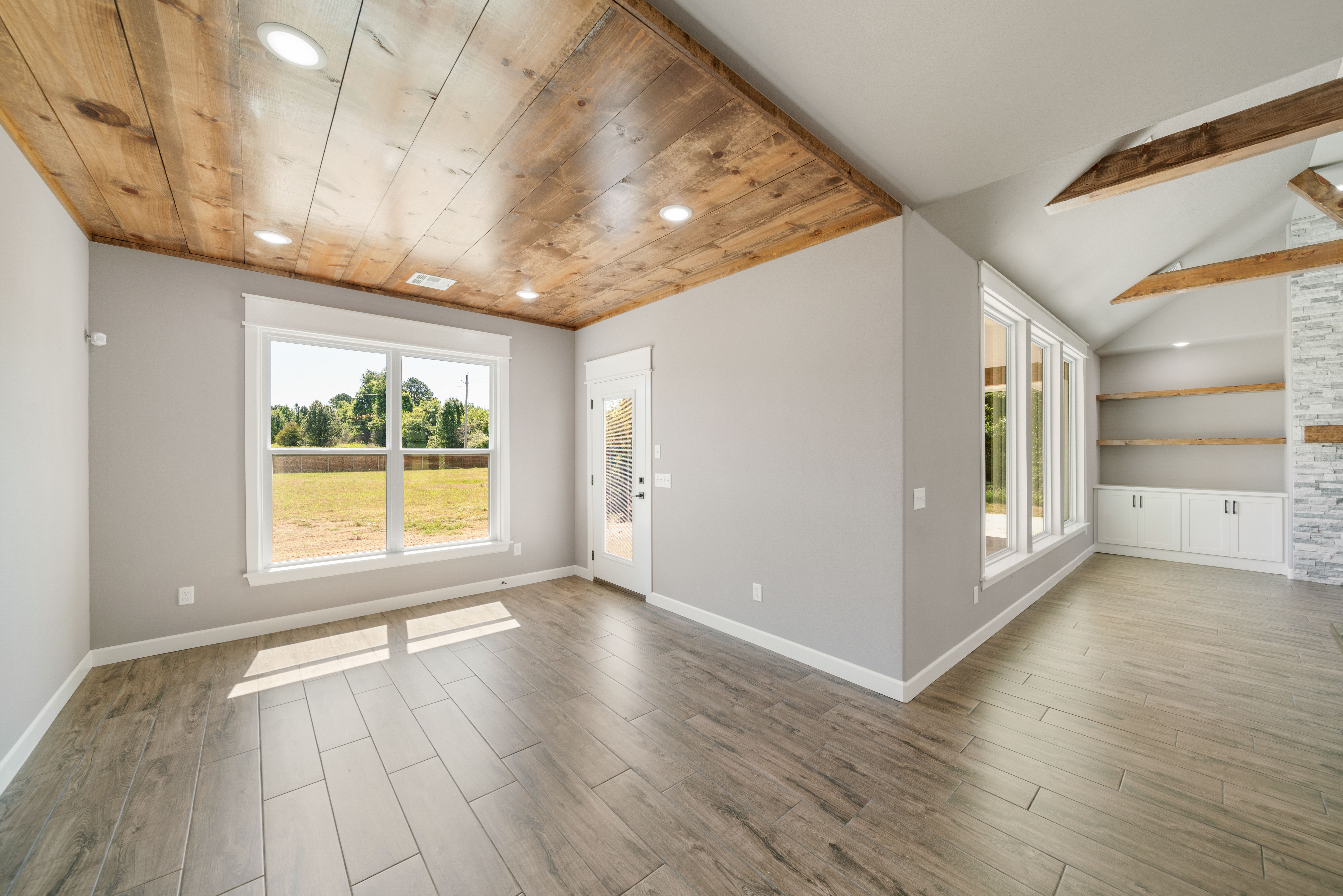 Spacious floor plan with expansive open areas and a modern kitchen layout by Mahogany Homes Tulsa