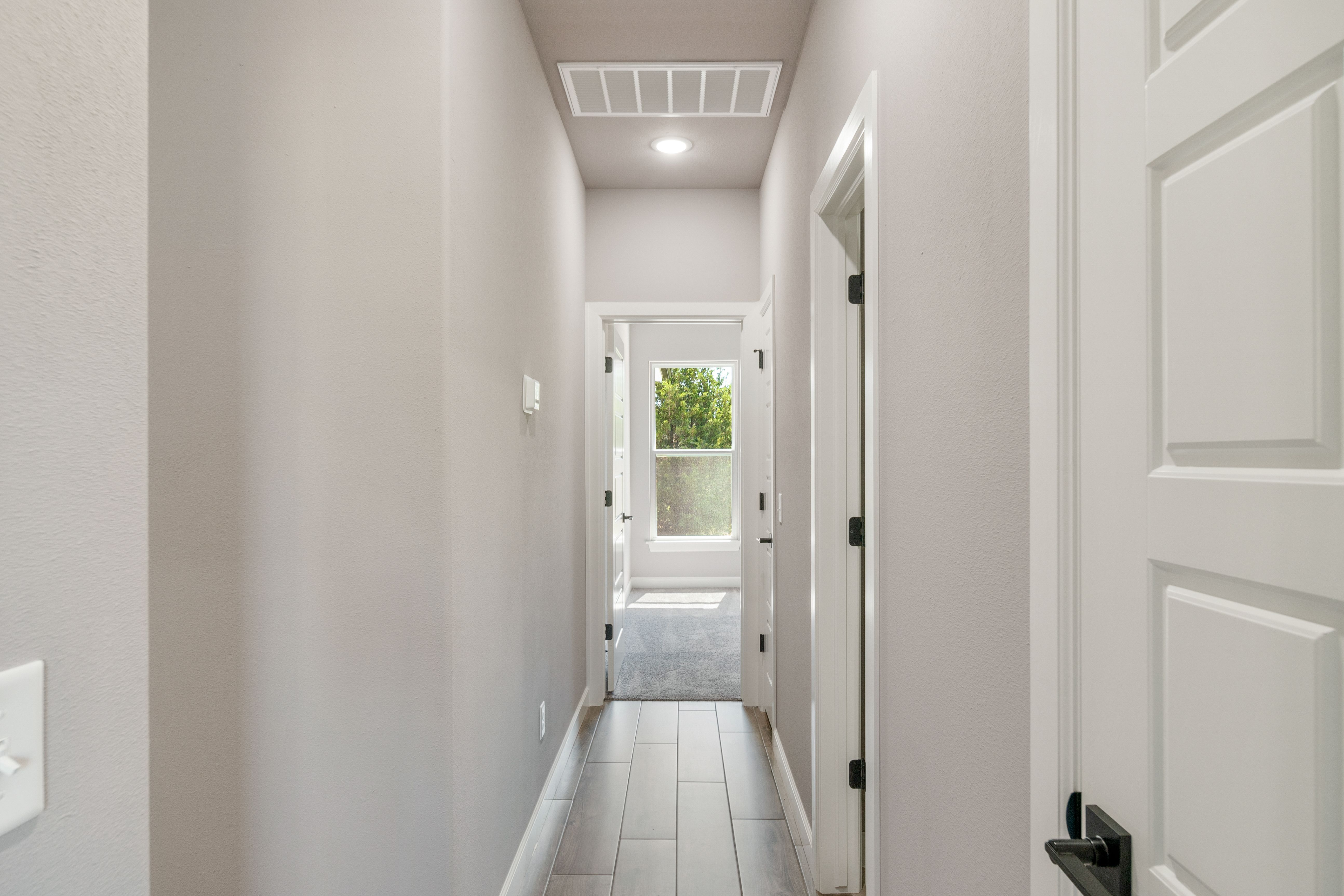 Smartly configured floor plan with generous space for entertaining and relaxation by Mahogany Homes Tulsa