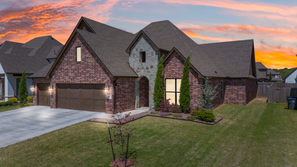 Custom-designed home exterior with rich architectural details by Mahogany Homes Tulsa.