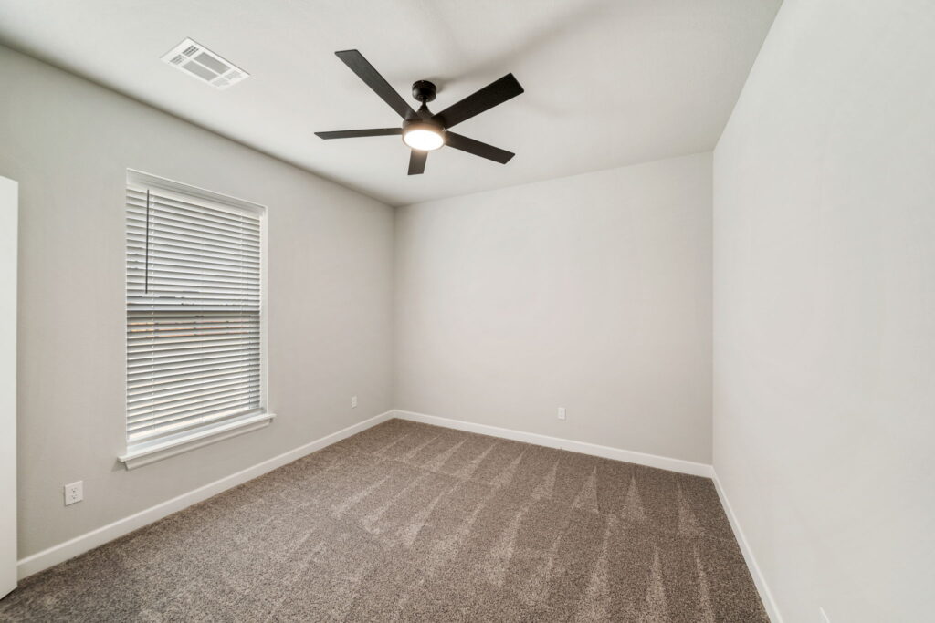 Custom floor plan with open living spaces and modern design elements by Mahogany Homes Tulsa.