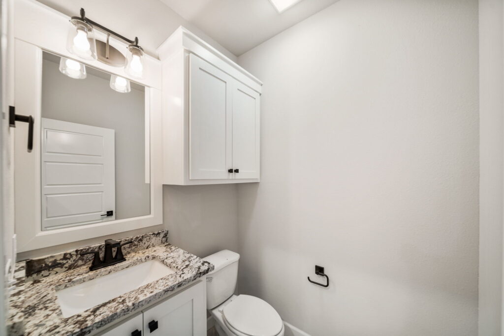 Stylish bathroom featuring custom design elements, high-end finishes, and a spacious layout by Mahogany Homes Tulsa.