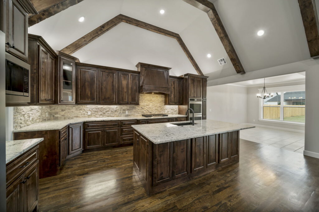 Custom-designed kitchen with modern finishes by Mahogany Homes Tulsa.