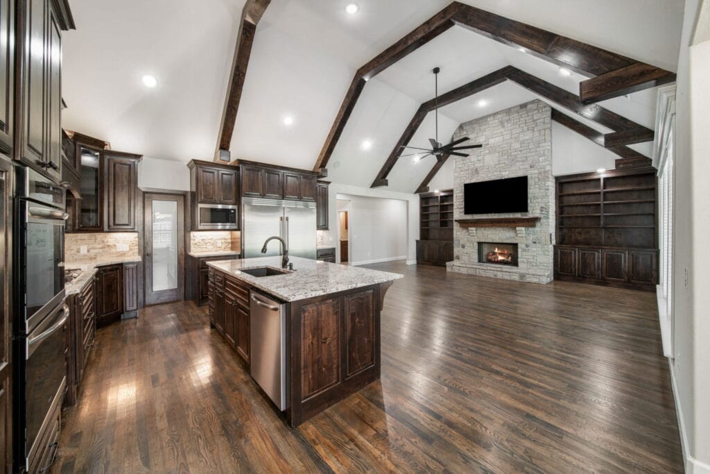 Warm, inviting living room with designer finishes by Mahogany Homes Tulsa