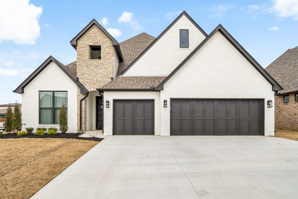 Contemporary home exterior with eco-friendly features by Mahogany Homes Tulsa.