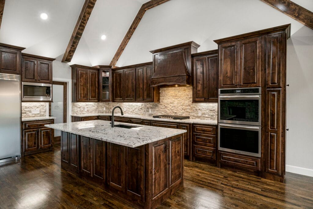 Contemporary kitchen with custom cabinetry and luxury finishes by Mahogany Homes.