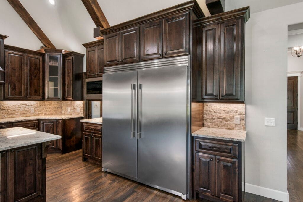 Chef-inspired kitchen with professional-grade appliances by Mahogany Homes Tulsa.