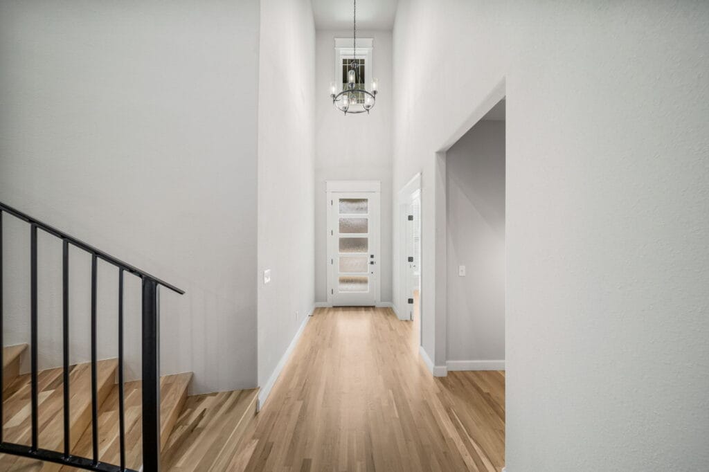 Open and airy floor plan with a large family room and kitchen designed for entertaining by Mahogany Homes Tulsa.