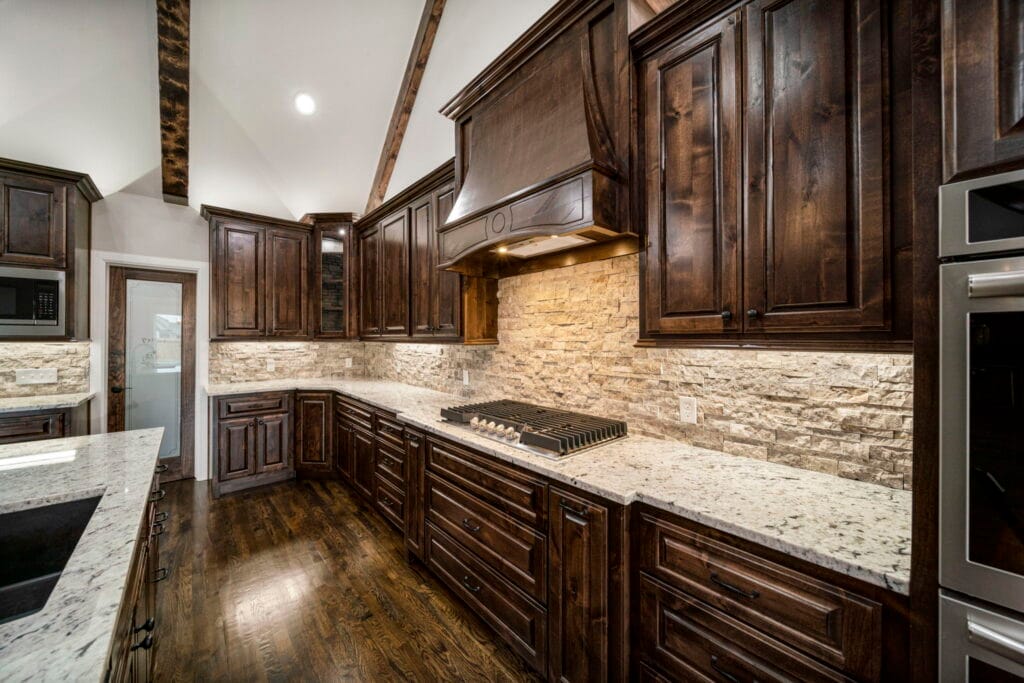 Functional and sleek kitchen with innovative design elements by Mahogany Homes Tulsa.
