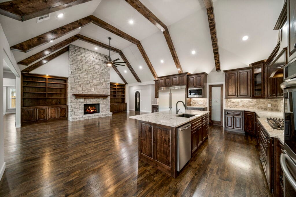 Inviting living room with large windows and open-concept design by Mahogany Homes Tulsa.