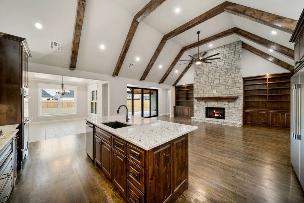 Contemporary living room featuring custom lighting and premium finishes by Mahogany Homes.