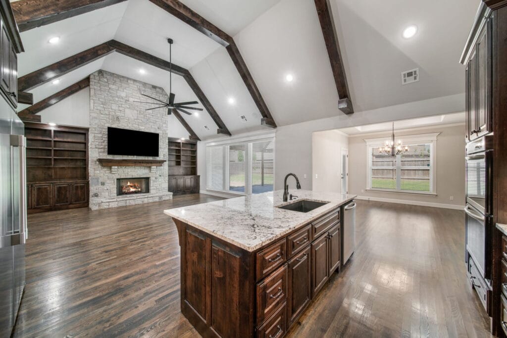 Spacious living room with contemporary decor and abundant natural light by Mahogany Homes Tulsa