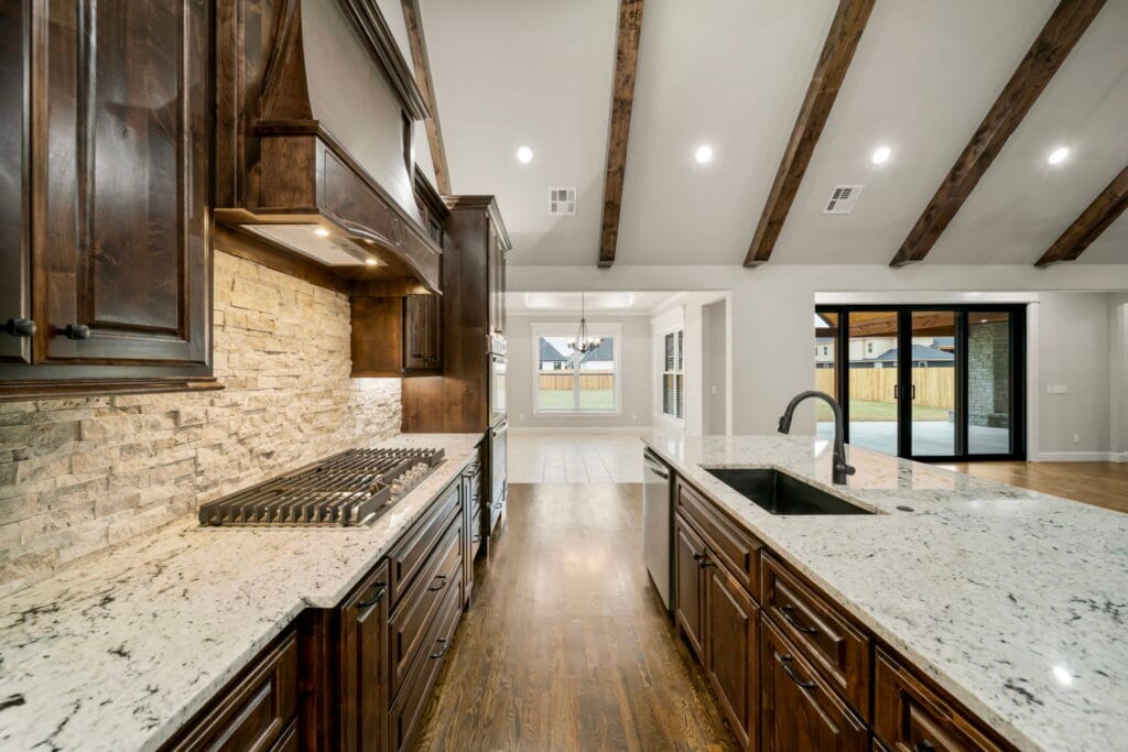 Sophisticated living room with a mix of contemporary design and luxurious finishes by Mahogany Homes.