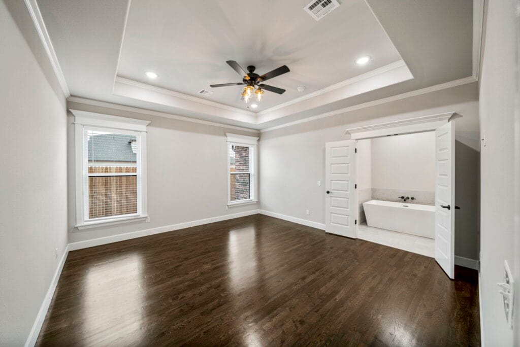Custom floor plan featuring high ceilings and open spaces by Mahogany Homes Tulsa.