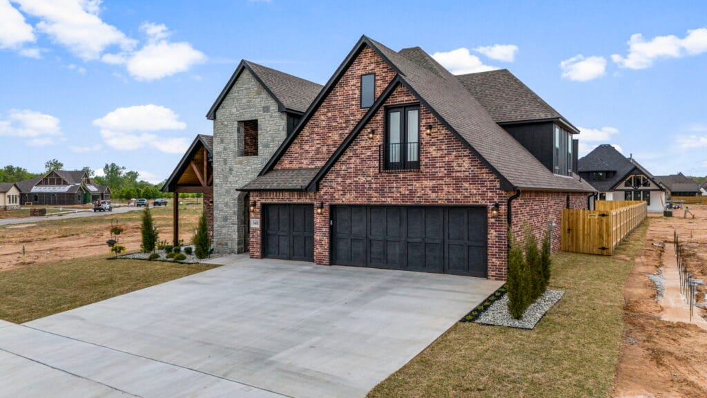 Chic and stylish custom home exterior with a unique design by Mahogany Homes Tulsa
