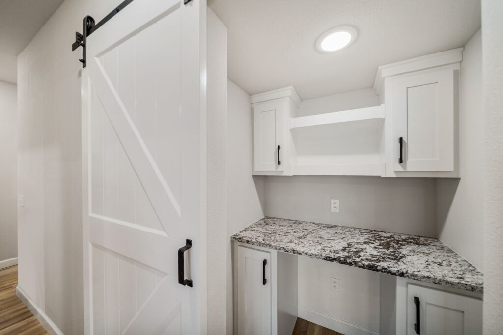 Well-thought-out floor plan with efficient use of space, including a bright, open living area by Mahogany Homes Tulsa.