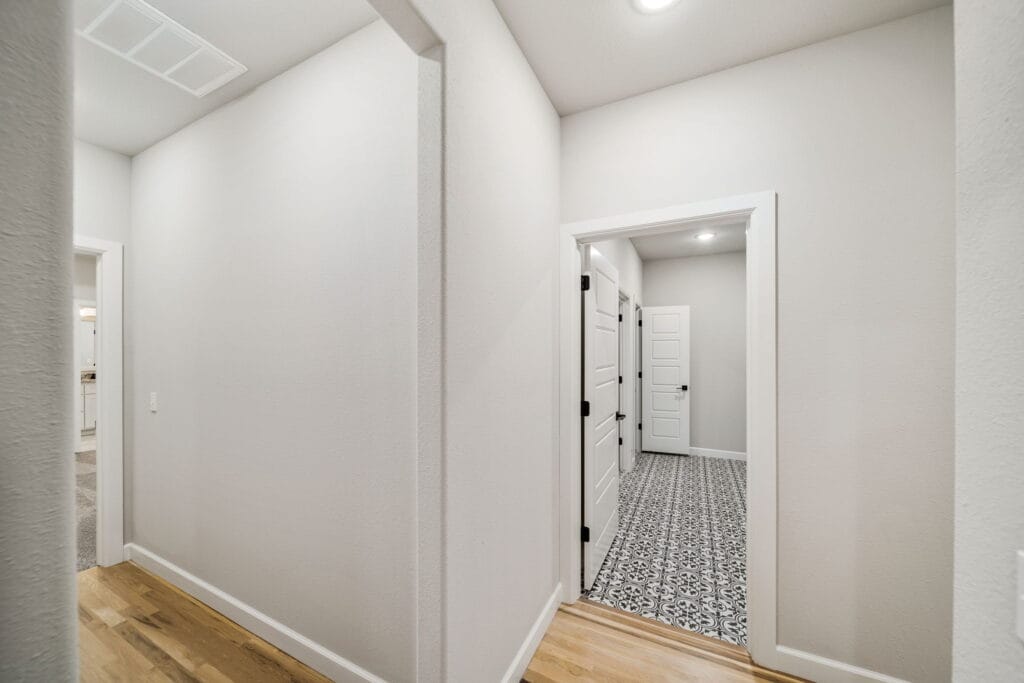 Luxury floor plan featuring high ceilings, custom finishes, and spacious rooms by Mahogany Homes.