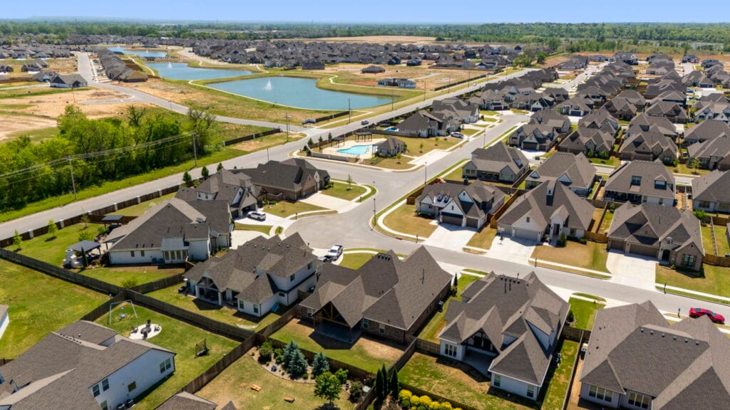Elegant home exterior featuring custom stonework and modern details by Mahogany Homes Tulsa.