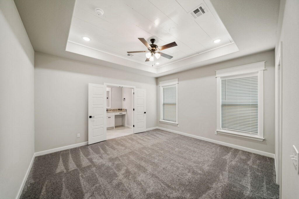 Efficient floor plan with clearly defined zones for living, dining, and relaxation by Mahogany Homes Tulsa.