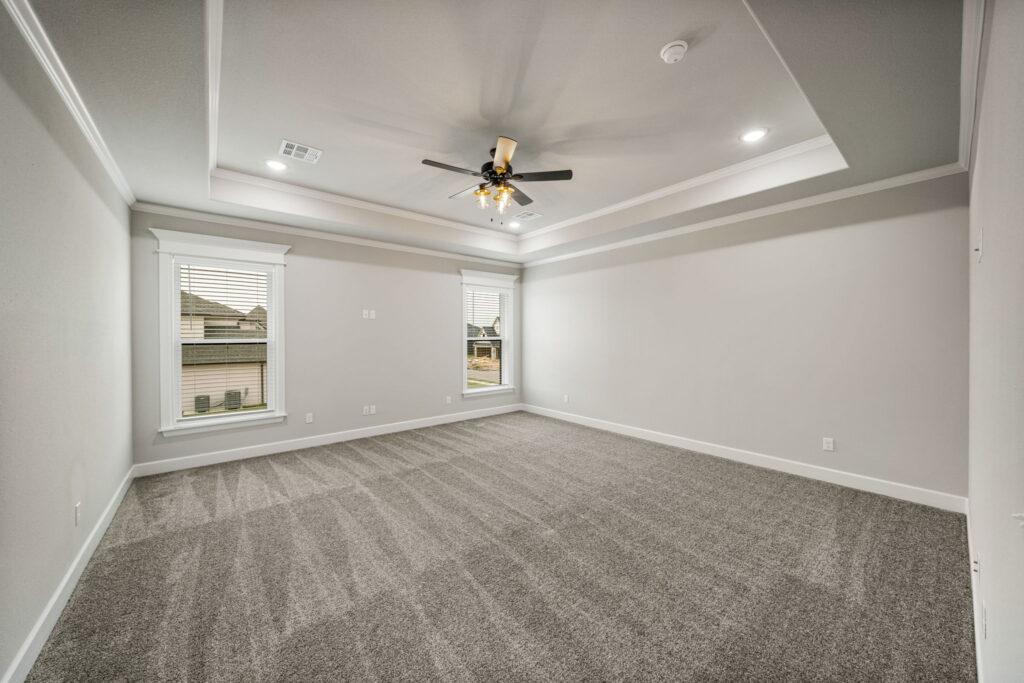 Elegant floor plan with expansive bedrooms and modern living areas by Mahogany Homes.