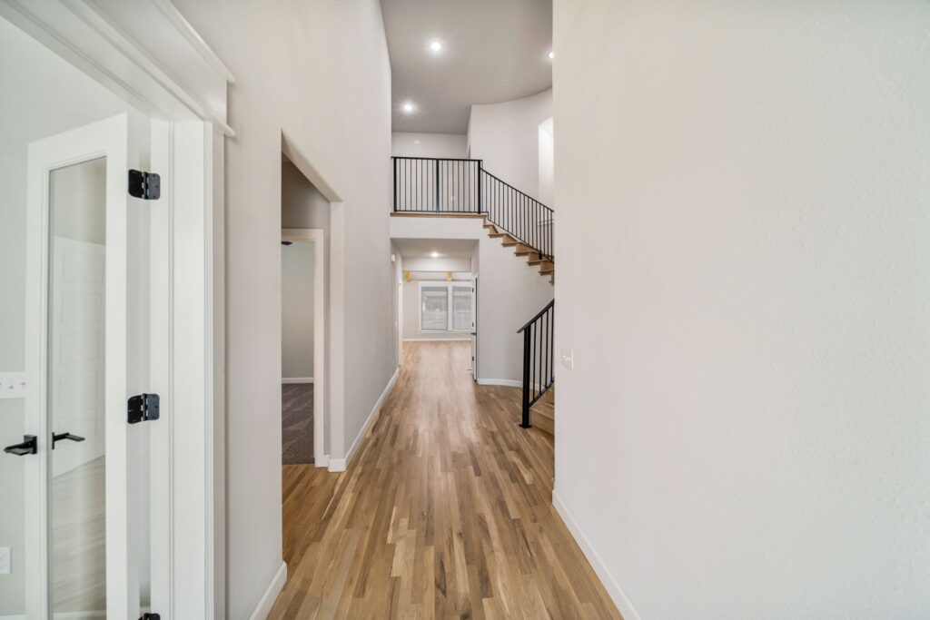 Unique home floor plan with a seamless flow between kitchen, dining, and living areas.