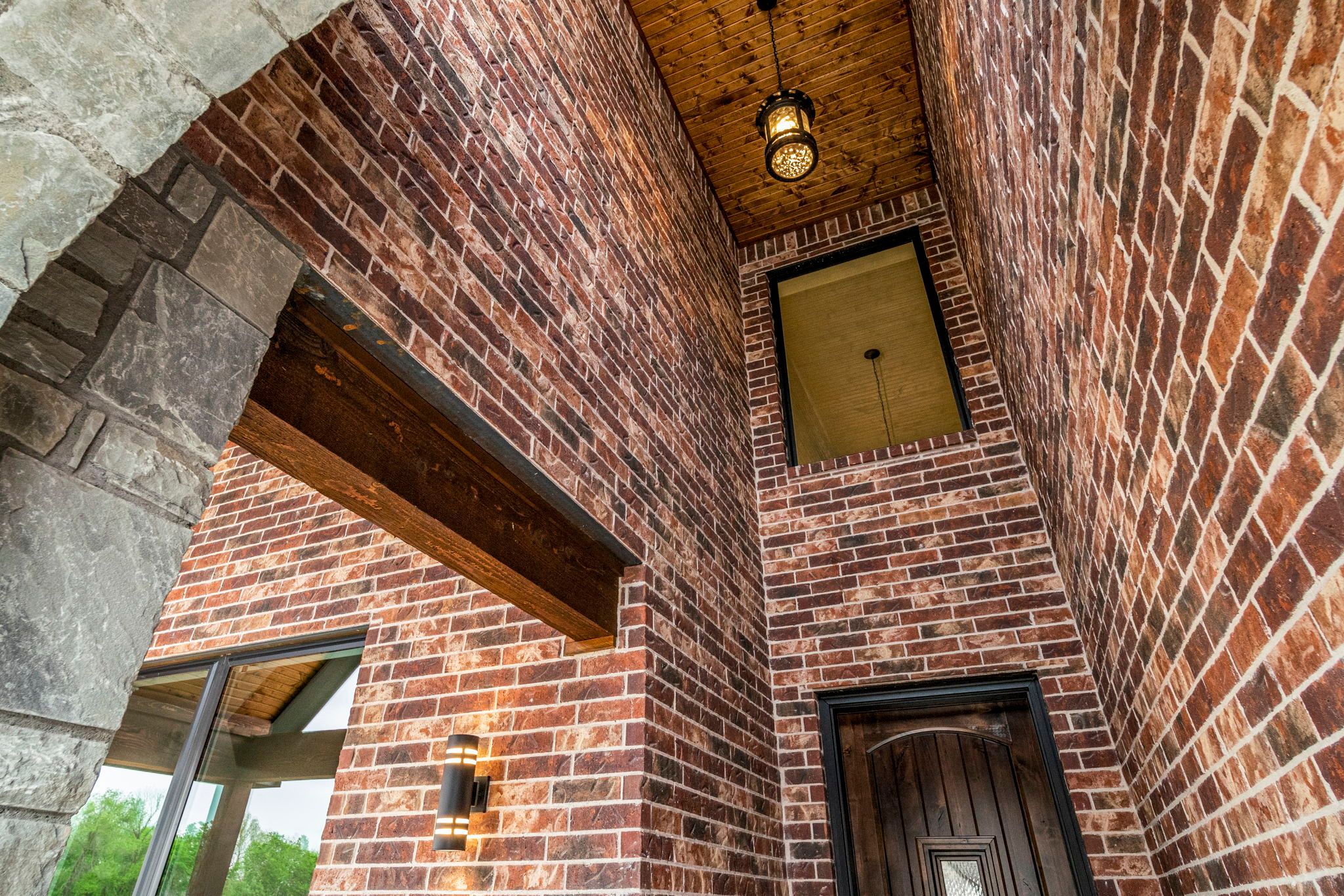Architecturally impressive exterior of a custom-built home by Mahogany Homes Tulsa.