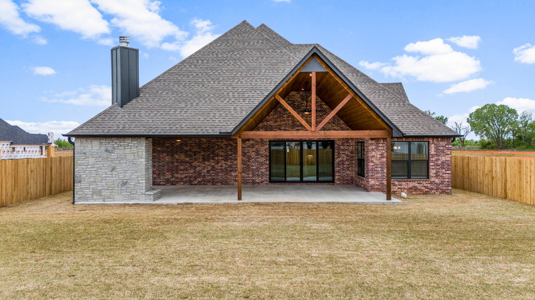 Bold and modern custom home exterior built by Mahogany Homes Tulsa with exquisite details.