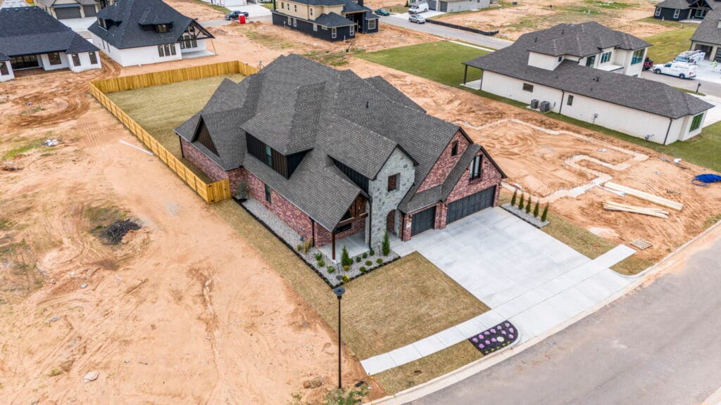 Bright and beautiful custom home exterior with clean lines by Mahogany Homes Tulsa.