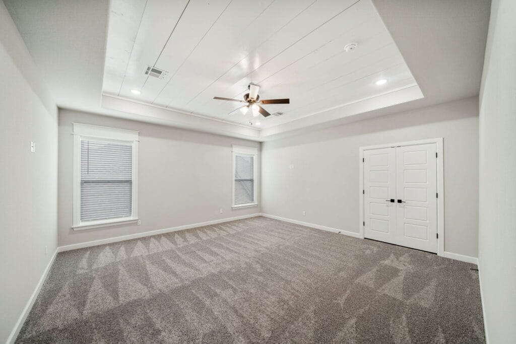 Custom floor plan featuring balanced living spaces and a designer kitchen by Mahogany Homes Tulsa.