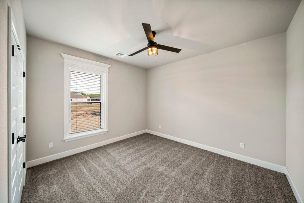 Functional and stylish floor plan with a large open living area by Mahogany Homes Tulsa